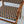 Handwoven rattan chair with geometric black and natural pattern, wooden frame, indoor setting