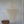 Large handmade seashell chandelier with white capiz shells in a minimalist room