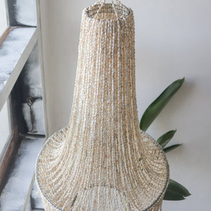 Handmade seashell chandelier with natural bead strands, eco-friendly home decor