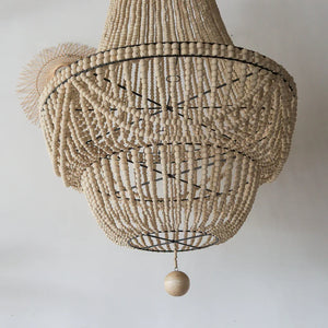 Handmade Balinese beaded chandelier with natural wood beads and elegant boho decor style