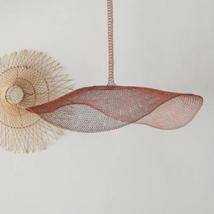 Handmade rattan pendant light with woven mesh shade, modern Balinese home decor