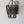 Handmade black beaded chandelier with rustic boho wall art on a white background