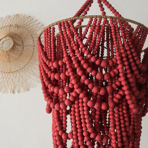Red beaded boho chandelier with intricate hanging strands, eco-friendly decor