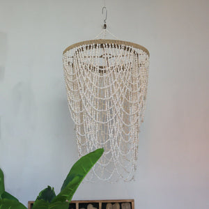 Handmade Balinese seashell chandelier with layered shell strands, boho home decor