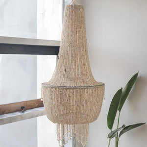 Handmade Balinese seashell chandelier with elegant beaded design in a bright modern room