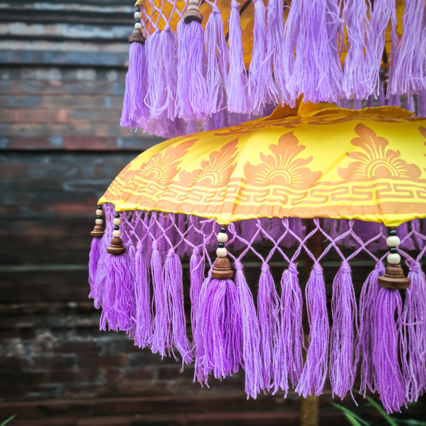 Triple Bali parasol in Yellow with Purple Fringe
