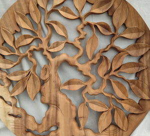 Hand-carved wooden wall art with tree of life design and intricate leaf details