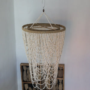 Handmade white seashell beaded chandelier with natural rope accents, coastal decor