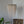 Handmade white seashell chandelier with cascading beads in a minimalist room