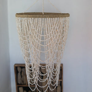 Handmade white seashell beaded chandelier with natural fiber frame, coastal home decor