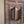 Hand-carved wooden window frame with intricate floral and geometric patterns