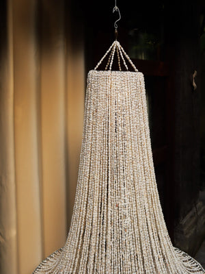 Handmade Balinese seashell chandelier with cascading shell strands, luxury boho decor
