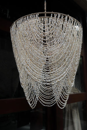 Handmade Balinese seashell chandelier with cascading beaded design, luxury home decor