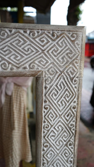Hand-carved wood frame with intricate Balinese geometric patterns, rustic white finish
