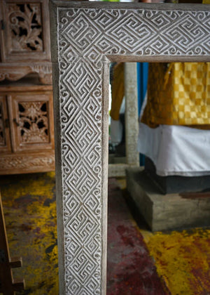 Hand-carved Balinese wood mirror frame with intricate geometric patterns