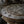 Hand-carved wooden stool with intricate Balinese geometric and swirl patterns