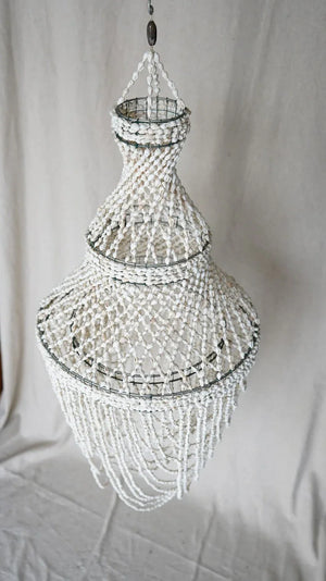 Handmade Balinese seashell chandelier with tiered white shell strands for home decor