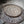 Hand-carved wooden plate with intricate geometric Balinese patterns and rustic finish