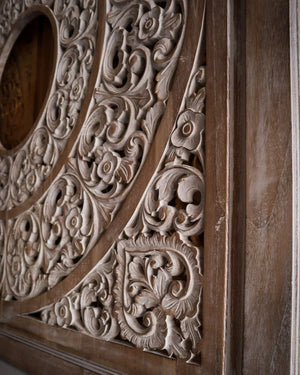Balinese hand-carved wooden panel with intricate floral and geometric patterns