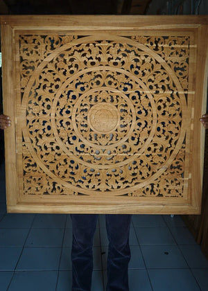 Hand-carved Balinese wooden wall panel with intricate floral mandala pattern