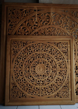 Hand-carved Balinese wood panel with intricate floral and mandala designs