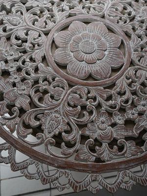 Hand-carved wooden panel with intricate floral and leaf patterns, Balinese decor style