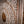 Hand-carved Balinese wood door with intricate floral patterns and circular details