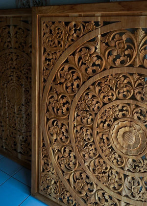 Hand-carved Balinese wood panel with intricate floral and geometric patterns