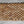Handcrafted teak wood woven placemat with natural finish on fabric background
