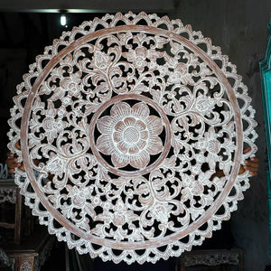 Hand-carved Balinese wooden wall art with intricate floral mandala design