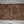 Handwoven wooden placemat with geometric pattern on linen fabric
