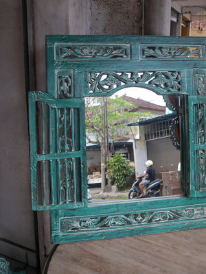 Hand-carved Balinese teal wooden window frame mirror with ornate floral details