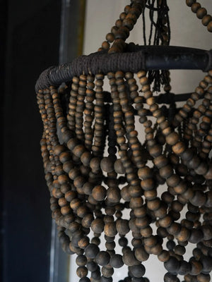 Handmade wooden bead chandelier with dark, rustic finish for eco-friendly home decor