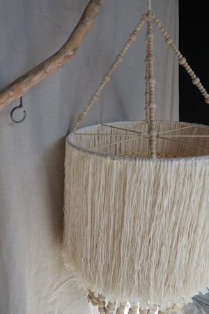 Handmade fringed pendant light with natural wood beads, boho style home decor