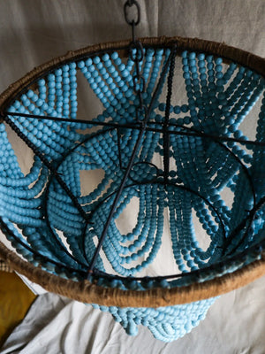 Handmade chandelier with blue beads and natural fiber frame, eco-friendly hanging decor